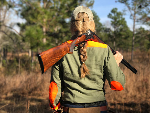 Female hunter in padded shirt