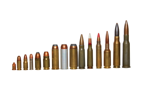 Row of different caliber bullets set upright from shortest to tallest