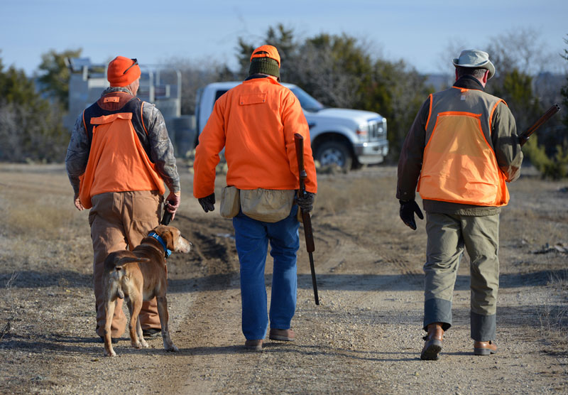 Three hunters and a dog who have used The Ultimate Packing Guide for their Hunting Trip 