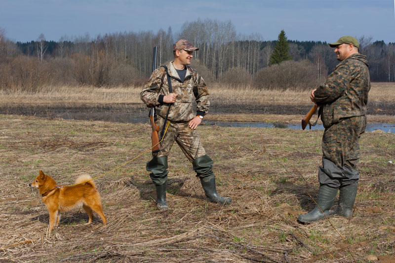 Two hunters and a dog