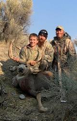 boy jeffrey&#39;s first buck with dad and gramps